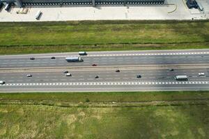 High Angle View of British Motorways and Highways and Traffic on M1 Junction 11a of Luton and Dunstable England UK. Image Was Captured on August 15th, 2023 photo