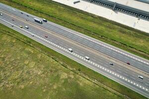 High Angle View of British Motorways and Highways and Traffic on M1 Junction 11a of Luton and Dunstable England UK. Image Was Captured on August 15th, 2023 photo