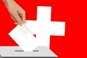 hand drops the ballot election against the background of the Switzerland flag, concept of state elections, referendum photo