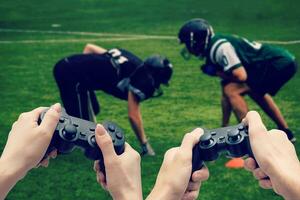 hands with joystick play football photo