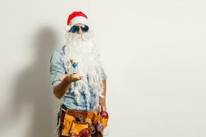 Santa Claus. Young Happy Emotional Santa Man Winner Gesture. formula Stylish Colorful New Year Holiday photo