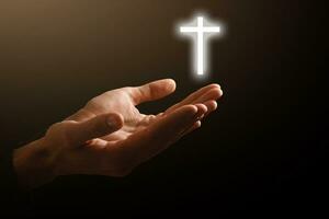 Man hands praying in dark background photo