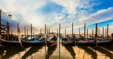 Gondolas of Venice in the morning light. Italy. photo