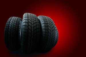 winter tyre cover on black red background photo