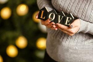 inscription love in the hands photo