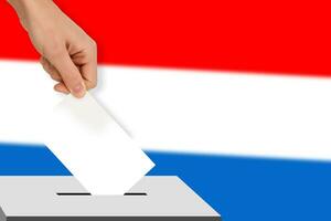 hand drops the ballot election against the background of the flag, concept of state elections, referendum photo
