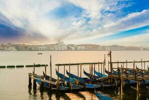 Gondolas of Venice in the morning light. Italy. photo