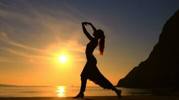 Sea, silhouette to the beautiful girl at sunset photo