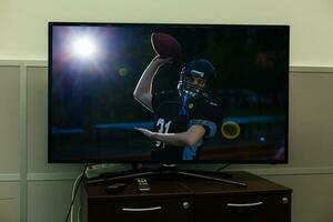 football match football on the big screen tv photo