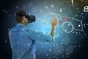 Engineer Wearing Augmented Reality Headset Working on New Electric Car Chassis Platform. 3D Graphics Visualization Virtual Model of a Vehicle is Tested photo