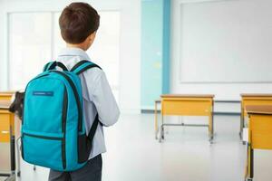 Back view of a schoolboy with a backpack standing in the classroom.  AI Generative Pro Photo