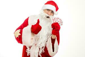 santa claus with playing cards on white background photo