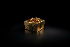 golden gift box with gold ribbons on a black background. Gift, New Year, Christmas, Black Friday photo