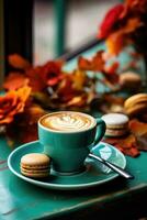 A cup of coffee cappuccino on a table in a cafe. candle, cozy photo