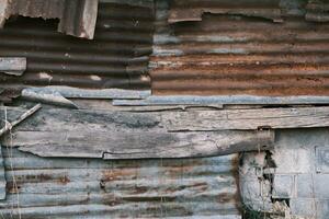 Old wall with zinc rusting with old wood photo