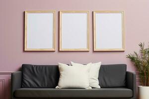 Three empty mockup wooden frames on a light pink wall over soft gray sofa photo