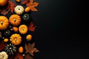 halloween flat lay mockup pumpkins and autumn leaves on black background with copy space photo