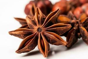 Extreme close up of dry spicy anise stars isolated on white photo