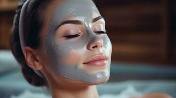 Woman receiving facial mask treatment photo