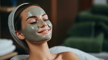 Woman receiving facial mask treatment photo