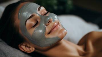 Woman receiving facial mask treatment photo