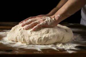 closeup of man's hands making dough side view photo