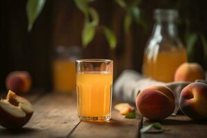 peach or apricot juice in a glass among peaches on wooden surface and blurred background photo