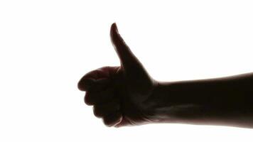 silhouette de femme main donnant pouce en haut sur blanc Contexte video