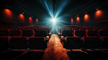 Cinema seats with spotlight and blank screen photo