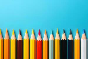 Colored pencils, isolated on the blue background. image with copy space photo