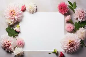 mockup square white blank card with pink dahlia flowers and leaves photo
