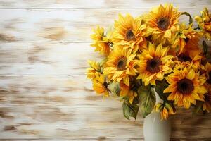 Beautiful bouquet of sunflowers in a vase on a wooden table top background, floral autumn template flat lay with copy space photo