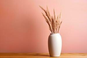 White vase with dry grass on a light pink background photo