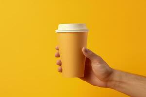 Hand holding coffee cup, yellow background. Generative AI photo