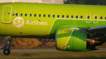 NOVOSIBIRSK, RUSSIAN FEDERATION JUNE 10, 2020 - S7 passenger airliner landing and braking. The moment of touching the runway. Airbus A320 of S7 airlines slows down after landing at Tolmachevo airport video