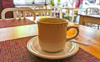 Cup of americano black coffee in restaurant cafe in Mexico. photo