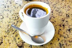 Cup of americano black coffee in restaurant Costa Rica. photo