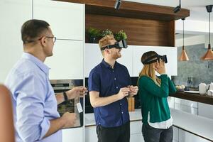 Couple wearing VR glasses shopping for a new kitchen in showroom photo