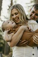 Happy mother hugging her little son outdoors photo