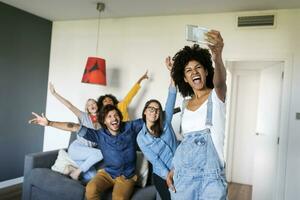 Cheerful friends taking a selfie at home photo