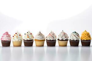 close up view of various sweet cupcakes on white background for sweet shop promotion photo