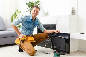 Portrait of a smiling television technician photo