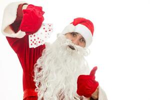 santa claus with playing cards on white background photo