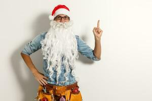 Santa Claus. Young Happy Emotional Santa Man Winner Gesture. formula Stylish Colorful New Year Holiday photo