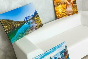 wall art canvas in three parts. Sofa, in room interior. photo