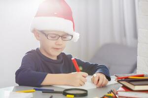 a little boy writing a letter to Santa photo