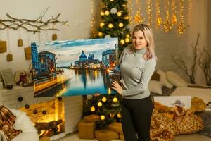 woman in studio with photo canvas