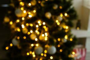 blur light celebration on christmas tree with white wall background photo