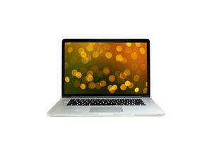 Open laptop isolated on white background desk. festive blur screen photo