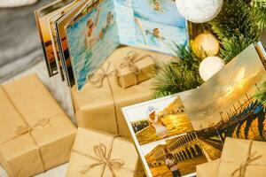 book together near Christmas tree in front of fireplace photo